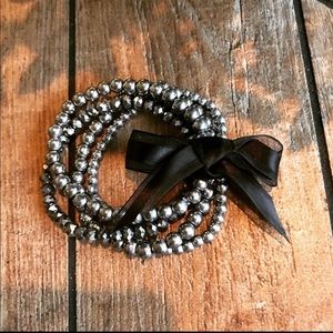 Set of 4 silver tone bead bracelets